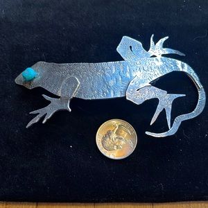 Western sterling silver handmade hair accessory with turquoise accent eye.